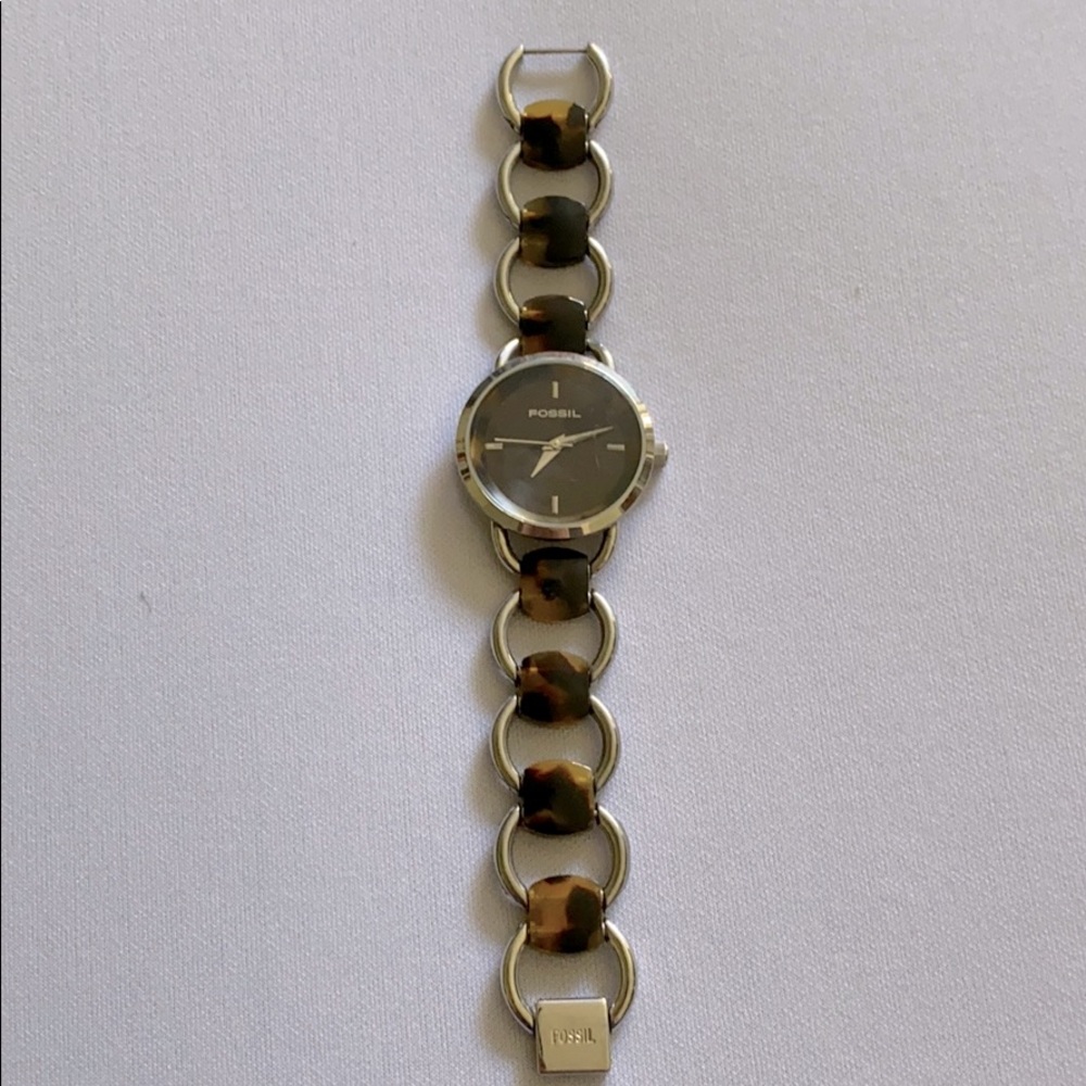 Fossil tortoise with silver chain link watch